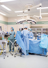 Image showing Doctors Operating Patient