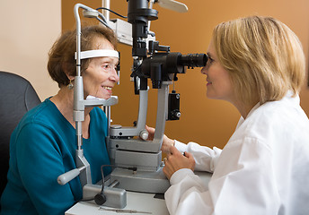 Image showing Eye Doctor Examining Woman's Vision