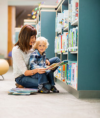 Image showing Student With Teacher Reading Book In Library