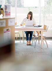 Image showing Student Writing Notes In Library