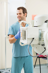 Image showing Nurse Adjusting Xray Machine