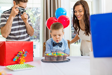 Image showing Family Celebrating Son's Birthday At Home