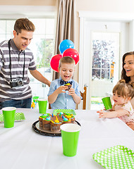 Image showing Family Celebrating Boy's Birthday At Home