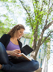 Image showing Student Using Digital Tablet While Studying