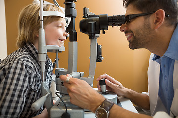 Image showing Optometrist Examining Boy's Eyes With Slit Lamp