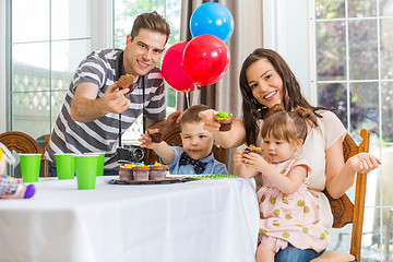 Image showing Family Showing Cupcakes At Birthday Party