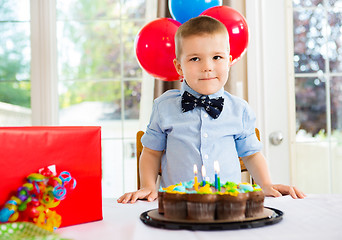 Image showing Birthday Boy With Cake And Present On Table