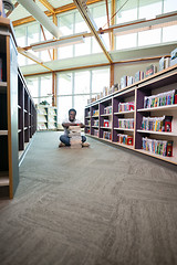 Image showing Student With Stack Of Books In Library