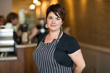 Image showing Confident Female Owner Smiling At Cafeteria