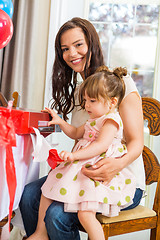 Image showing Mother With Birthday Girl Opening Present