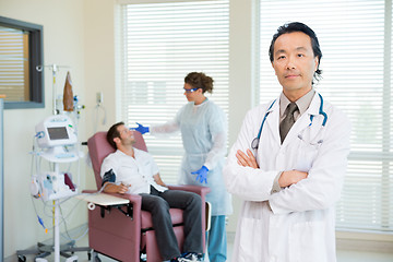 Image showing Doctor With Patient Being Examined By Pulse Rate Machine