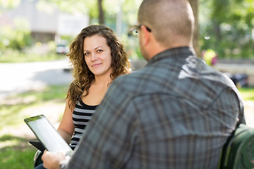 Image showing Female Student Sitting With Male Friend At Campus