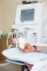 Image showing Patient Holding Glass Of Crushed Ice In Dialysis Room
