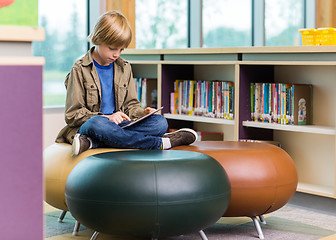 Image showing Schoolboy Using Digital Tablet In Library