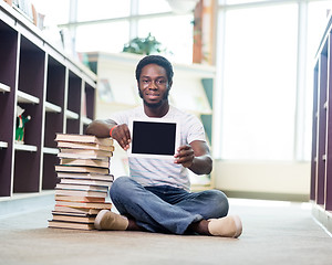 Image showing Student With Books Showing Digital Tablet In Library