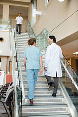 Image showing Doctor And Nurse Climbing Up Stairs In Hospital