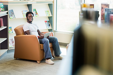 Image showing Smiling Student With Digital Tablet In Library