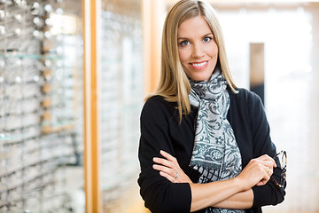 Image showing Woman Holding Glasses In Optician Store