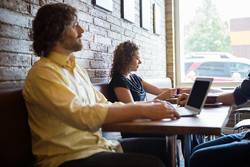 Image showing Customers Spending Leisure Time In Coffeeshop