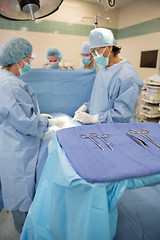 Image showing Surgeons Operating in Surgical Theater