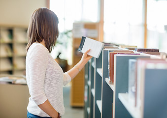 Image showing Student Reading Book In Library