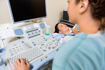 Image showing Nurse Using Ultrasound Treatment On Patient's Neck