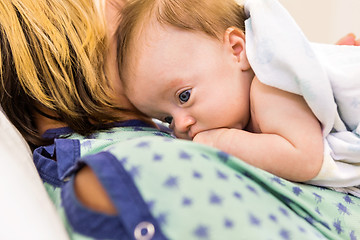 Image showing Babygirl Lying On Mother In Hospital