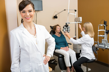 Image showing Confident Optometrist With Colleague Examining Patient