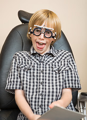 Image showing Boy With Trial Frame Making Funny Face At Optician