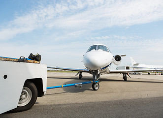 Image showing Private Jet Towed By Ground Crew