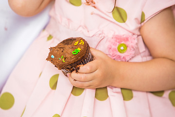 Image showing Birthday Girl Holding Cupcake