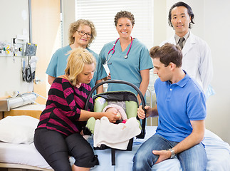 Image showing Successful Medical Team With Newborn Baby And Parents In Hospita