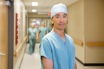 Image showing Surgeon With Team Walking In Hospital Corridor