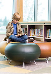 Image showing Boy Using Digital Tablet In Library