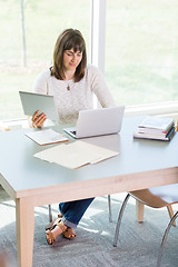 Image showing Student Using Technologies While Studying In Library