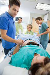 Image showing Caring Man Holding Woman's Hand During Delivery In Hospital