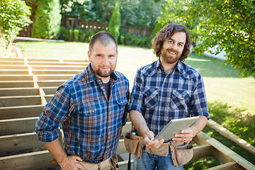 Image showing Construction Workers With Digital Tablet At Construction Site