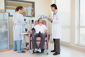 Image showing Patient Looking At Doctor Holding Digital Tablet In Hospital Roo