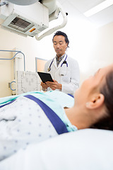 Image showing Radiologist Using Digital Tablet In Examination Room