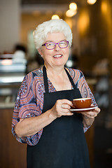 Image showing Happy Waitress With Coffee Cup In Cafeteria