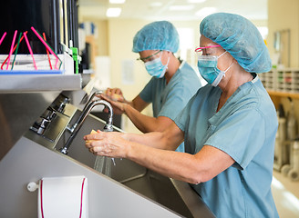 Image showing Scrubbing Hands and Arms Before Surgery