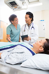 Image showing Medical Team With Digital Tablet While Patient On Xray Table