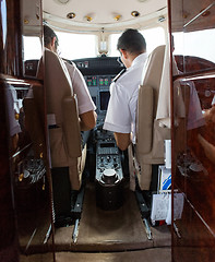 Image showing Pilot And Copilot Operating Private Jet