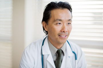 Image showing Thoughtful Doctor Smiling In Clinic