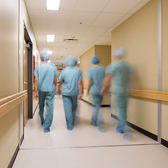 Image showing Medical Team Walking In Hospital Corridor