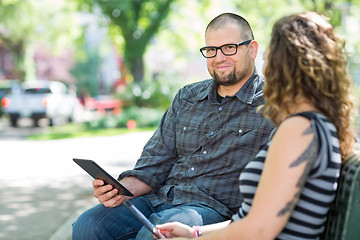 Image showing Smiling University Student Sitting With Friend On Campus