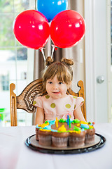 Image showing Girl Licking Lips In Front Of Birthday Cake