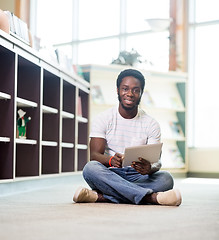 Image showing Confident Student With Digital Tablet In Library