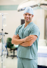 Image showing Smiling Surgeon Standing Arms Crossed