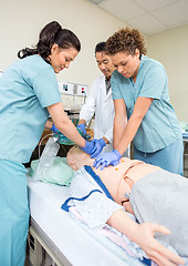 Image showing Medical Team Performing CPR On Dummy